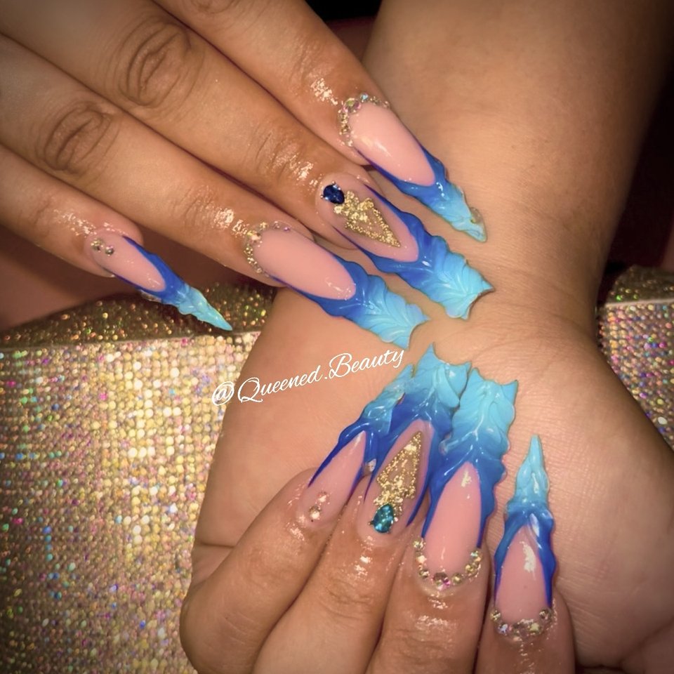Manicured nails displayed on a salon hand.
